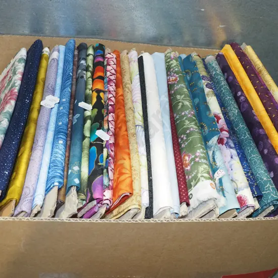 box of fabric pieces