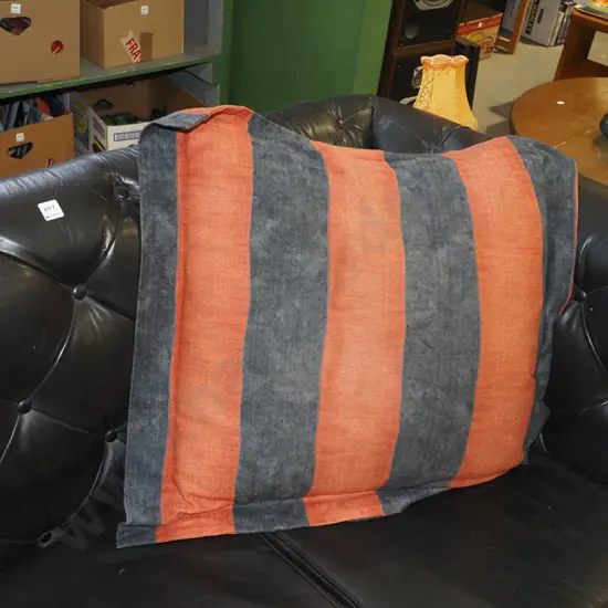large charcoal and rust orange cushion