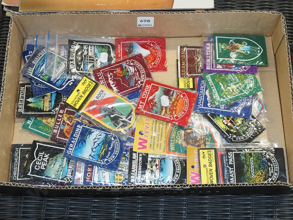 box of NZ tourist badges and emblems Image 1++
