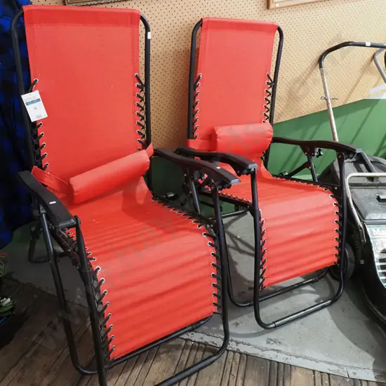 pair of red Outdoor Zero Gravity chairs