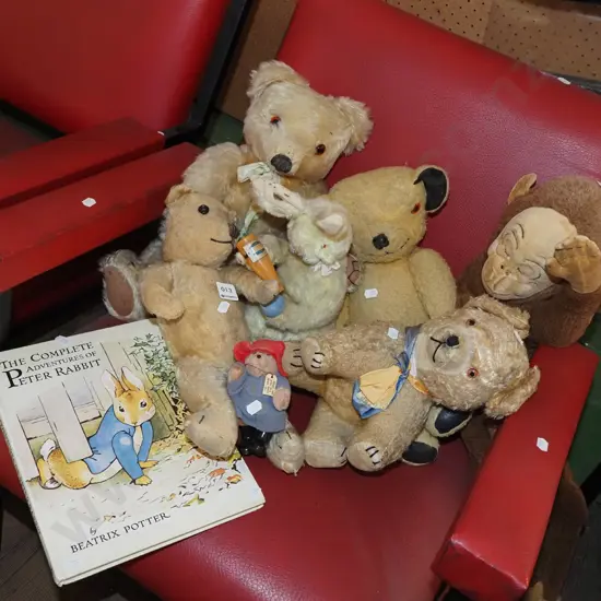 assorted teddy bears, rabbits, Beatrix Potter book