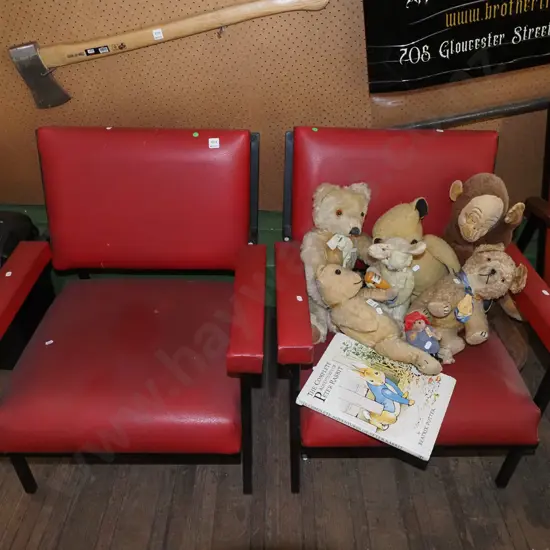 pair of metal and red vinyl chairs - wear to vinyl - green dots