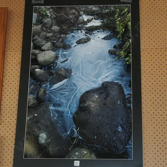 unframed photograph - ice in stream