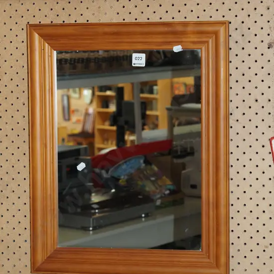small wood framed wall mirror