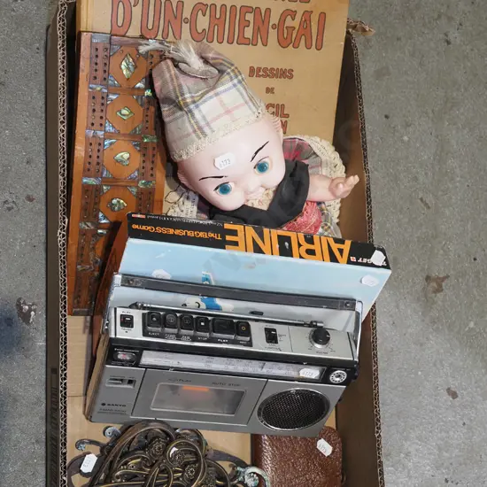 box; doll, books, cribbage scorer, cassette player - as is no returns etc