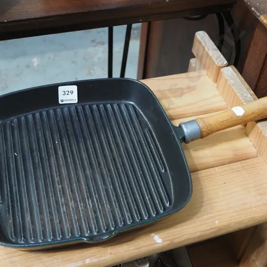 cast iron and enamel skillet with wooden handle