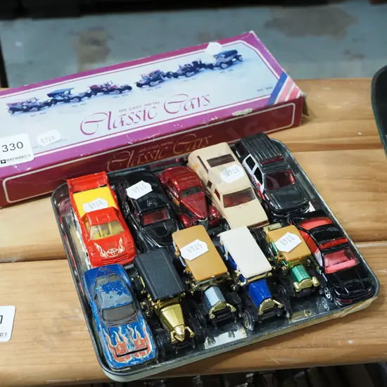 tray and box of toy vehicles