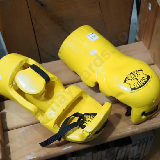 pair of yellow martial arts sparring gloves