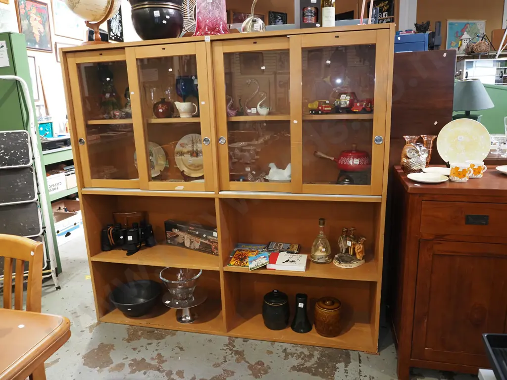 solid rimu wall unit with 4 sliding glass display doors and lower shelving Image 1++