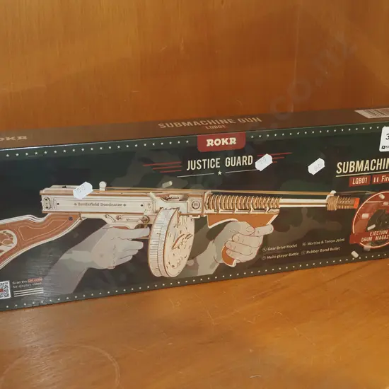 box of yet to be assembled model of sub machine gun