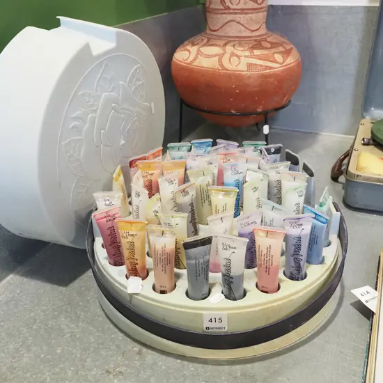 container of various fabric paints