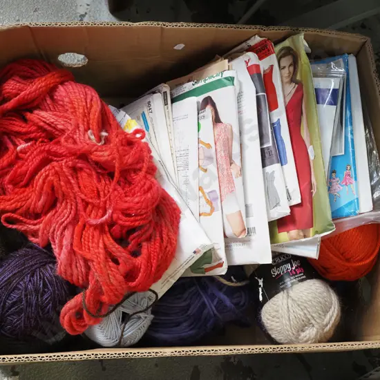 box; knitting yarn, sewing patterns