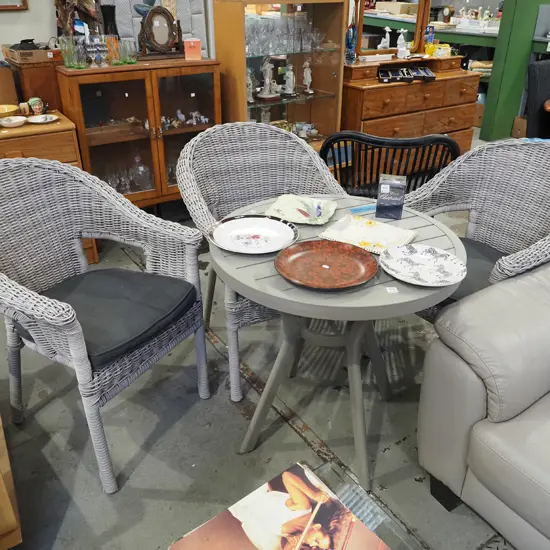 alloy pedestal outdoor table with 3 matching faux cane chairs with cushions