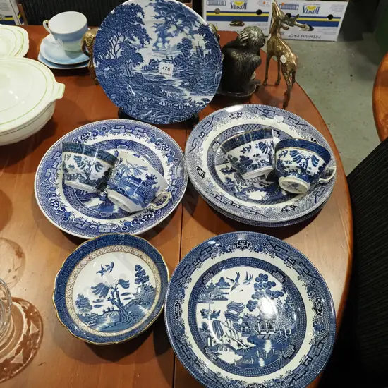 blue and white plates, bowls and cups