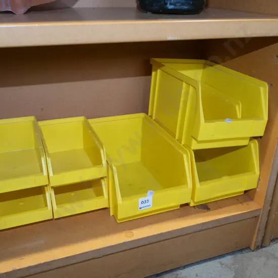 assorted  yellow plastic workshop/garage storage trays