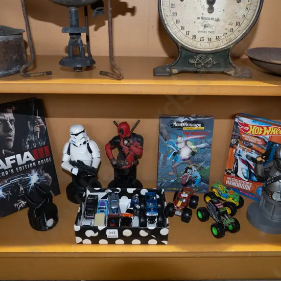 shelf; toy vehicles, figurines, graphic novel etc