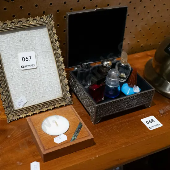 brass photo frame, candle, perfume bottles etc