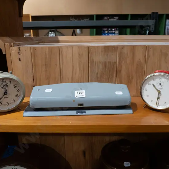 hole punch, 2x clockwork bedside clocks