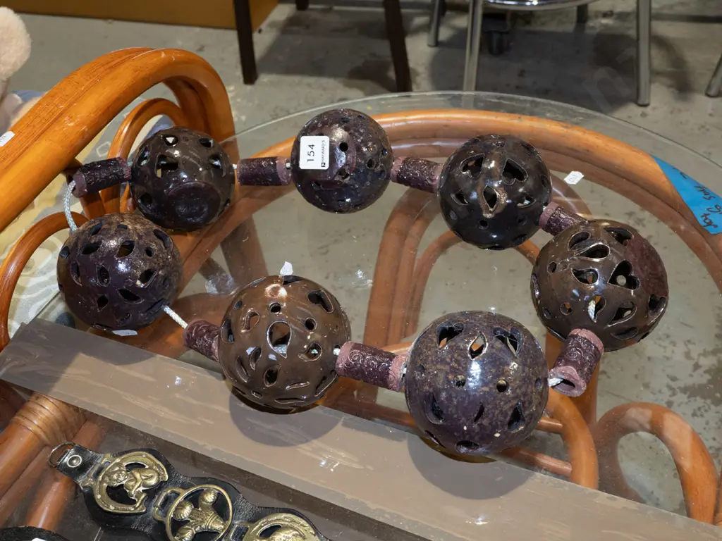 studio  pottery balls and cylinders on circular rope Image 1++