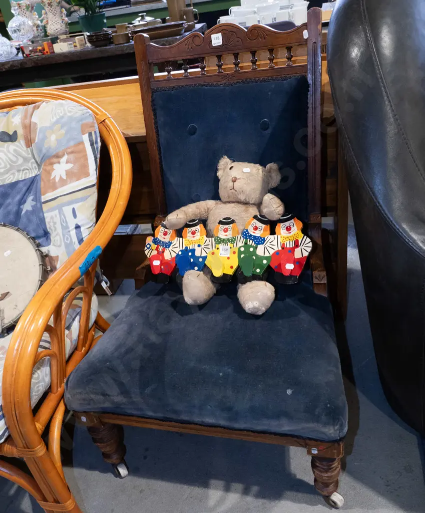 Edwardian blue deep buttoned upholstered ladies fireside chair with turned legs and enamel casters Image 1++