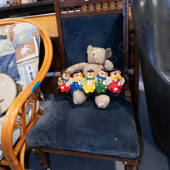 Edwardian blue deep buttoned upholstered ladies fireside chair with turned legs and enamel casters