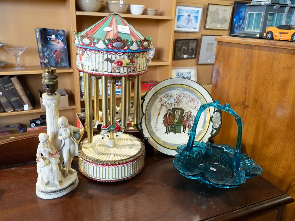 Royal Doulton plate, vintage battery powered carousel - as is, figural lamp base, blue glass basket Image 1++