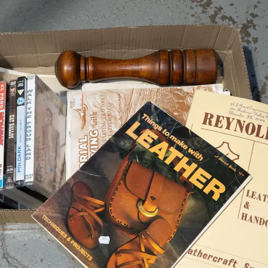 large wooden pepper grinder, leather work magazines etc