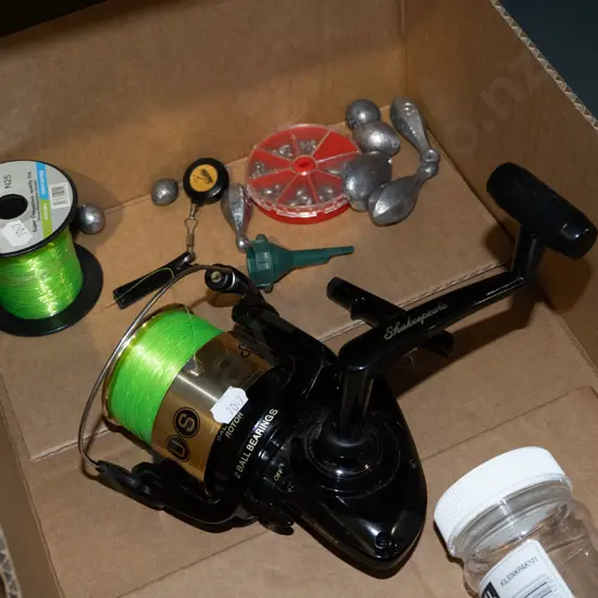 box; fishing reel, line, sinkers