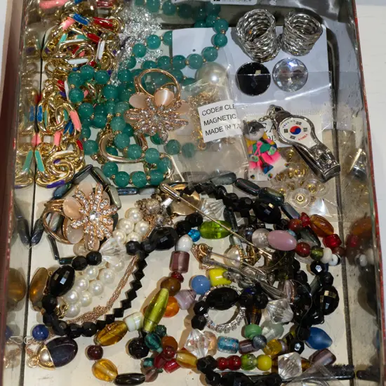 tin of costume jewllery
