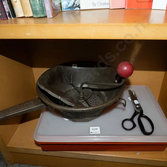 Tupperware container, pinking shears, mouli