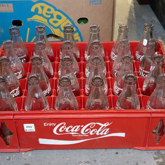 plastic crate and coca cola bottles