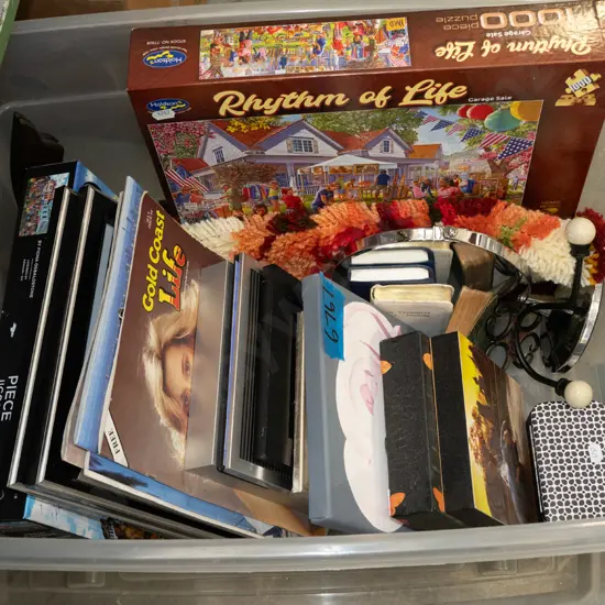plastic storage tub; puzzles, prints, coat hooks etc