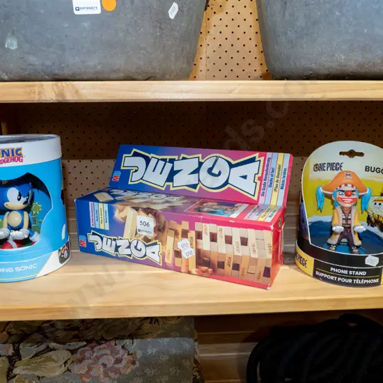 Sonic the Hedgehog figurine, pirate phone stand, jenga gun