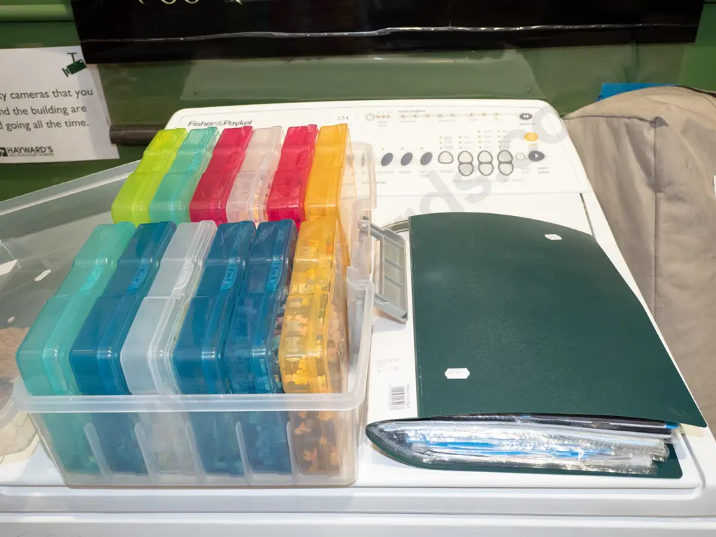 plastic organiser of miniature Lego type pieces, instruction folder Image 1++