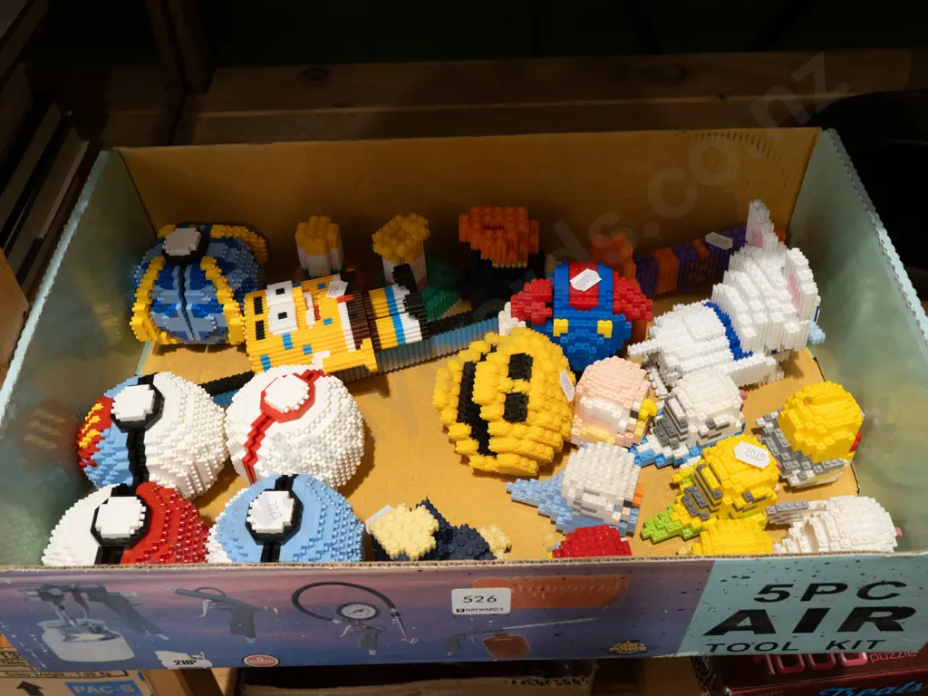 box of miniature Lego style figurines Image 1++