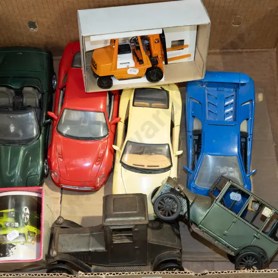 box; toy vehicles, coffee cup