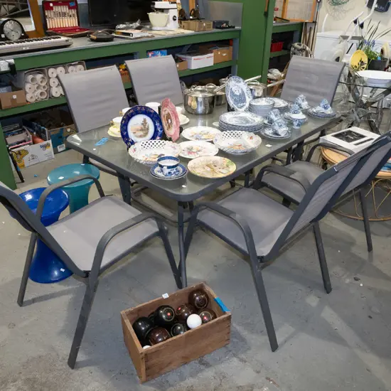 alloy and glass top table with 6 matching canvas upholstered chairs