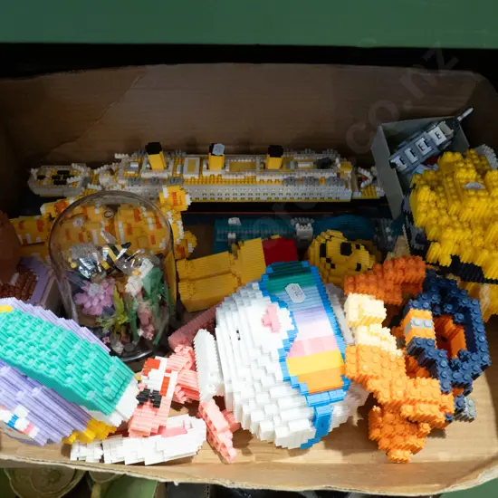 box of tiny deco type figurines