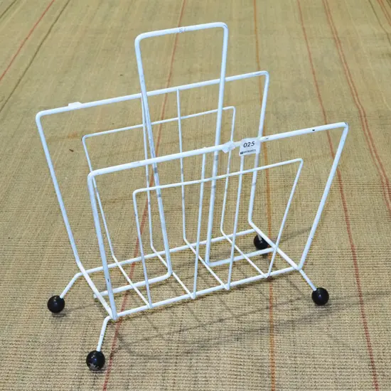 mid century wrought metal ball-footed magazine rack