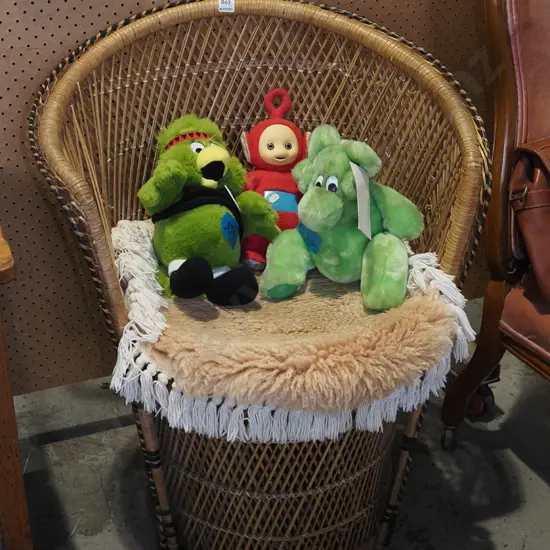 cane chair with sheepskin cushion