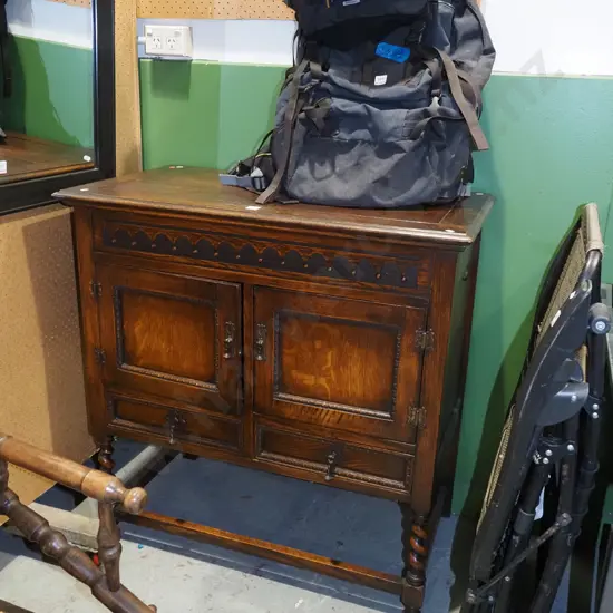 Edwardian oak 2 door, 2 drawer lift up gramophone cabinet with drop metal handles and carved details