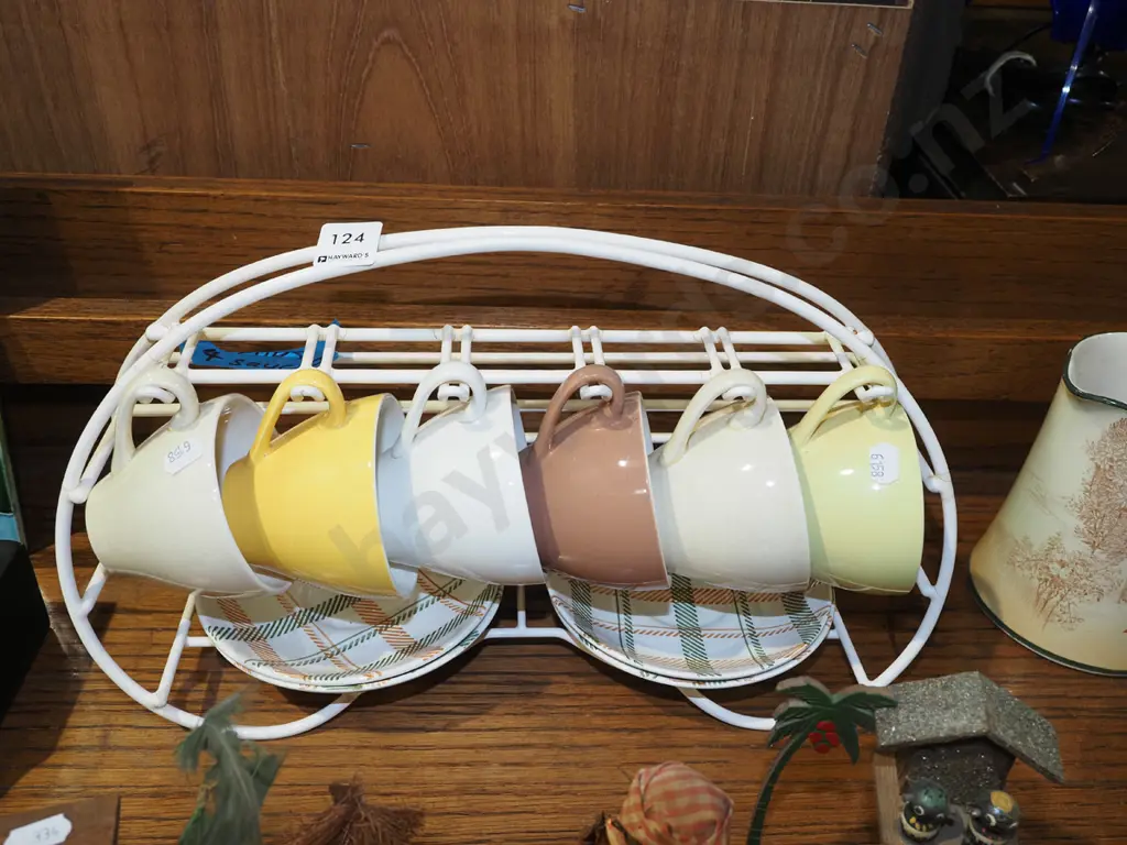 6x Crown Lynn cups, 4x saucers and plastic stand Image 1++