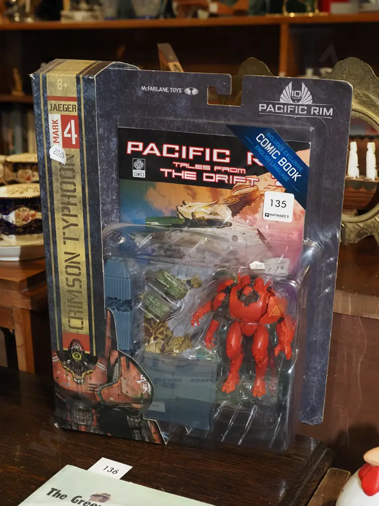 carded Pacific Rim action figurine with comic book Image 1++
