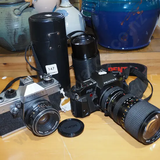 Praktica and Pentax 35mm cameras with lens and case