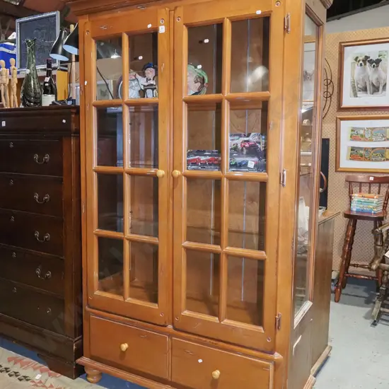 Indonesian hardwood 2 door display cabinet with 2 lowers drawers and internal shelves and glass side panels