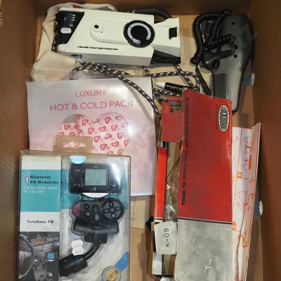 box; blue tooth FM modulator, travel iron, door hardware etc