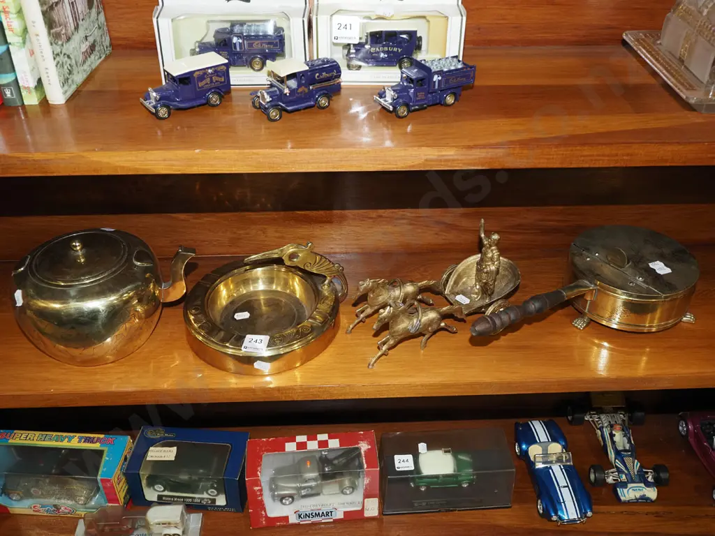 shelf of brass ware; teapot, ashtray etc Image 1++