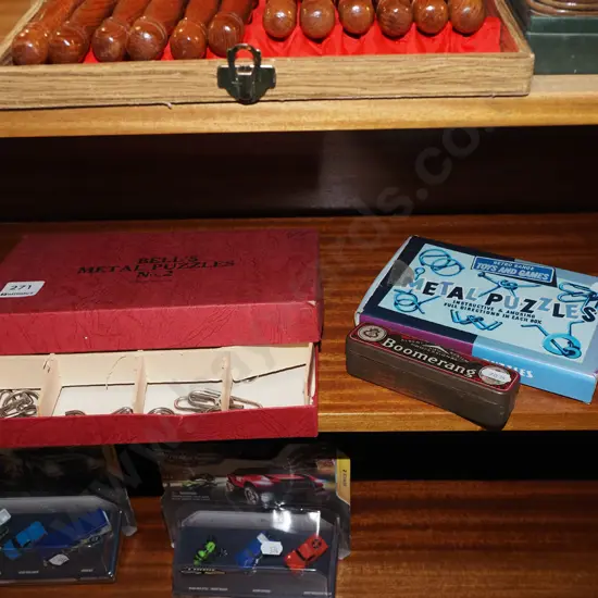 Boomerang harmonica and 2x boxes of metal puzzles
