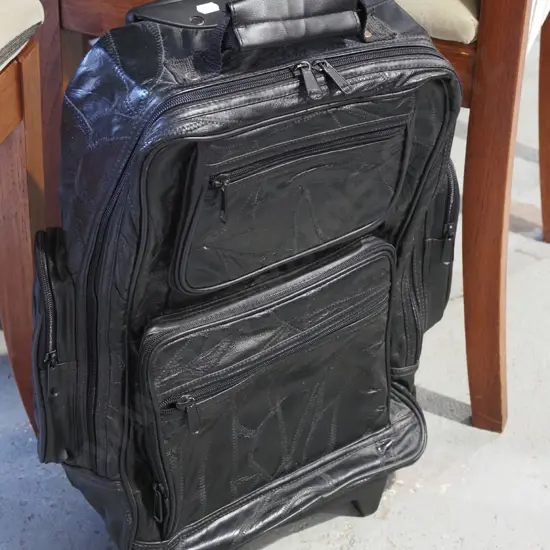 black vinyl carry on bag