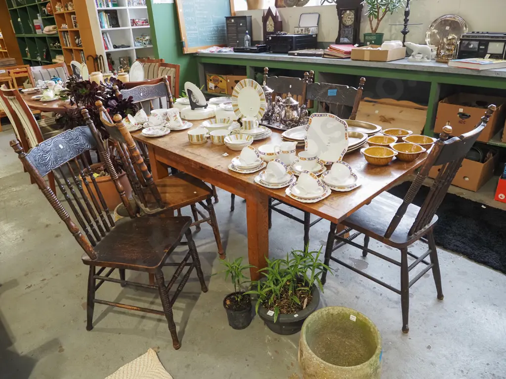 oak extending dining table with 6 dark stained pressed oak spindle back chairs  Image 1++